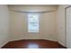 Simple bedroom with hardwood floors and a window at 300 Rocky Cove Trl, Lawrenceville, GA 30044