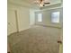 Large main bedroom with carpeted floors and ceiling fan at 465 Auburn Valley Way, Auburn, GA 30011