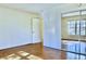 Well-lit bedroom with hardwood floors and mirrored closet at 4653 Flat Bridge Sw Rd, Stockbridge, GA 30281