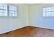 Spacious bedroom featuring hardwood floors and dual windows at 4653 Flat Bridge Sw Rd, Stockbridge, GA 30281