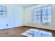 Bedroom with hardwood floors and large windows at 4653 Flat Bridge Sw Rd, Stockbridge, GA 30281