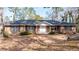 Brick ranch house with a large front yard and mature trees at 4653 Flat Bridge Sw Rd, Stockbridge, GA 30281
