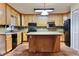 Kitchen with island and ample cabinetry at 4653 Flat Bridge Sw Rd, Stockbridge, GA 30281