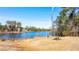 Peaceful lake access with picnic table and grill at 4653 Flat Bridge Sw Rd, Stockbridge, GA 30281