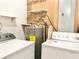 Updated laundry room with washer, dryer, and water heater at 4653 Flat Bridge Sw Rd, Stockbridge, GA 30281