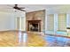 Spacious living room with brick fireplace and hardwood floors at 4653 Flat Bridge Sw Rd, Stockbridge, GA 30281