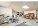 Unfinished basement space filled with clutter and various items at 5545 Woodsong Trl, Dunwoody, GA 30338