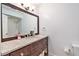 Bathroom with a shower and a dark wood vanity with stone countertop at 5545 Woodsong Trl, Dunwoody, GA 30338