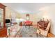 Inviting living room with hardwood floors, elegant rug, and beautiful antique furniture at 5545 Woodsong Trl, Dunwoody, GA 30338