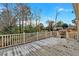 Spacious back deck with wooden railings, overlooking a tree-filled backyard at 2401 Prestige Valley Ct, Morrow, GA 30260