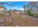 House backyard view with slight snow cover at 2401 Prestige Valley Ct, Morrow, GA 30260