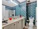 Bathroom with teal wallpaper and updated vanity at 2401 Prestige Valley Ct, Morrow, GA 30260