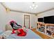 Bedroom with a bed, TV stand, and a massage chair at 2401 Prestige Valley Ct, Morrow, GA 30260