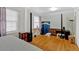 Large bedroom with king-size bed and hardwood floors at 2401 Prestige Valley Ct, Morrow, GA 30260
