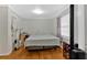 Main bedroom with king-size bed and hardwood floors at 2401 Prestige Valley Ct, Morrow, GA 30260