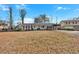 Ranch house with carport, mature trees, and yard at 2401 Prestige Valley Ct, Morrow, GA 30260