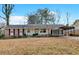 Brick ranch house with carport and spacious yard at 2401 Prestige Valley Ct, Morrow, GA 30260