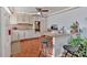 Bright eat-in kitchen with an island and wood flooring at 2401 Prestige Valley Ct, Morrow, GA 30260