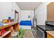 Laundry room with washer, dryer, and storage shelves at 2401 Prestige Valley Ct, Morrow, GA 30260