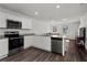 Modern kitchen with stainless steel appliances and an island at 608 Tudor St, Euharlee, GA 30145