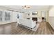 Bright living room with fireplace, hardwood floors, and sliding barn doors at 838 Cannon Run, Marietta, GA 30064