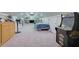 Upstairs bedroom featuring plush carpet, vaulted ceilings, built in shelving, and a video game machine at 4656 Bryant Rd, Snellville, GA 30039