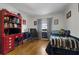 Comfortable bedroom with hardwood floors, decorated with red, white and blue accents and sports memorabilia at 4656 Bryant Rd, Snellville, GA 30039