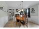 Cozy dining room with fireplace, wainscoting, and built-in shelving, perfect for Gathering meals and entertaining at 4656 Bryant Rd, Snellville, GA 30039