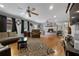 Expansive living room featuring hardwood floors, a brick fireplace, and comfortable seating at 4656 Bryant Rd, Snellville, GA 30039