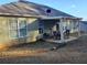 Covered patio with table and chairs, overlooking backyard at 110 Sampson Ct, Covington, GA 30016
