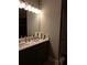 Double vanity bathroom with large mirror and updated fixtures at 110 Sampson Ct, Covington, GA 30016
