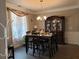 Formal dining room with a hutch and hardwood floors at 110 Sampson Ct, Covington, GA 30016