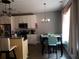 Kitchen with breakfast nook and white cabinets at 110 Sampson Ct, Covington, GA 30016