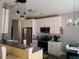 Modern kitchen with white cabinets, stainless steel appliances, and an island at 110 Sampson Ct, Covington, GA 30016