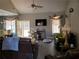 Spacious living room with hardwood floors, comfortable seating, and large TV at 110 Sampson Ct, Covington, GA 30016