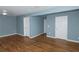 Hardwood floor bedroom with two closets and light blue walls at 4175 Danforth Sw Rd, Atlanta, GA 30331