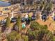 Aerial view of neighborhood with lake at 164 Castlewood Rd, Tyrone, GA 30290