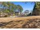 Large backyard with a swimming pool and plenty of green space at 164 Castlewood Rd, Tyrone, GA 30290