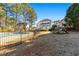 Large backyard with a swimming pool, playground, and fenced perimeter at 164 Castlewood Rd, Tyrone, GA 30290