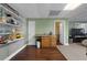 Basement kitchenette with wood cabinets and shelving at 164 Castlewood Rd, Tyrone, GA 30290