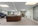 Finished basement with sectional sofa and home gym area at 164 Castlewood Rd, Tyrone, GA 30290
