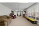 Spacious basement recreation room, great for exercise or relaxing, with large windows at 164 Castlewood Rd, Tyrone, GA 30290