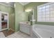 Bathroom with a shower, vanity, and a separate linen closet at 164 Castlewood Rd, Tyrone, GA 30290