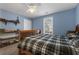 Serene bedroom featuring a double bed and built-in shelving at 164 Castlewood Rd, Tyrone, GA 30290