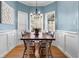 Bright dining room, hardwood floors, and elegant chandelier at 164 Castlewood Rd, Tyrone, GA 30290