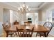 Dining room with wooden table and view of Primary bedroom at 164 Castlewood Rd, Tyrone, GA 30290