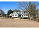 White two-story house with landscaping and a large front yard at 164 Castlewood Rd, Tyrone, GA 30290