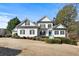 Two-story house with white siding, black shutters, and a teal front door at 164 Castlewood Rd, Tyrone, GA 30290