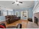 Bright living room with hardwood floors, fireplace, and recessed lighting at 164 Castlewood Rd, Tyrone, GA 30290