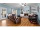 Cozy living room features hardwood floors, fireplace, and built-in shelving at 164 Castlewood Rd, Tyrone, GA 30290